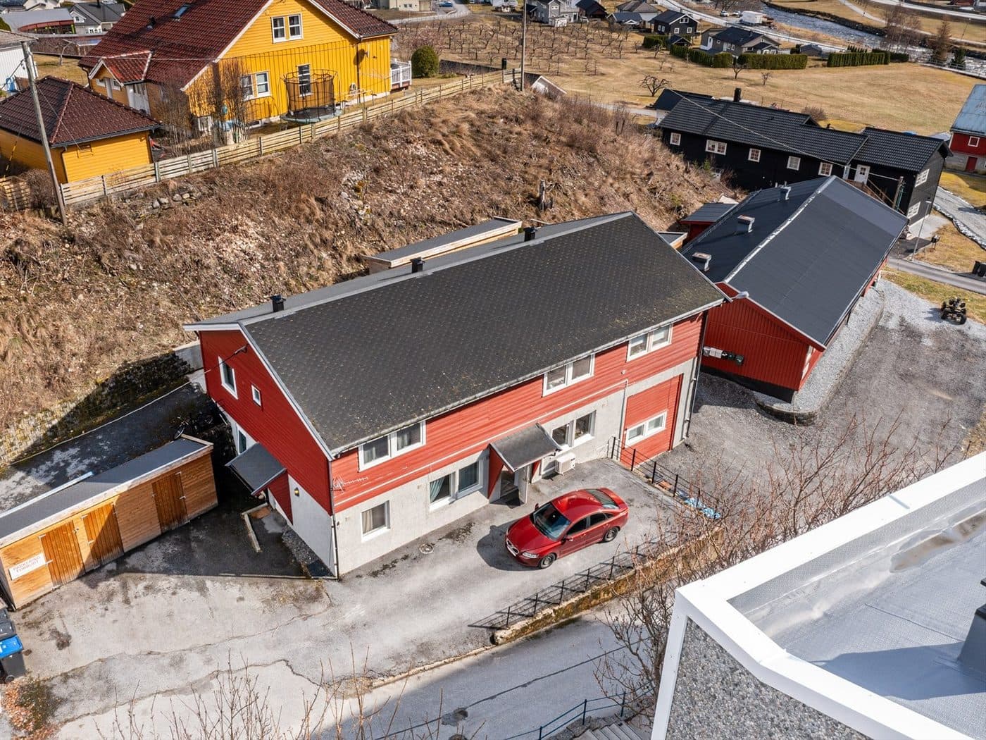 The house from above, with the fenced parking spot in front of the entrance