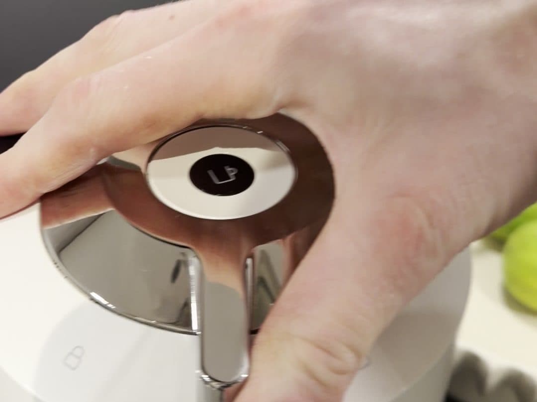 Turning the handle to lock the machine