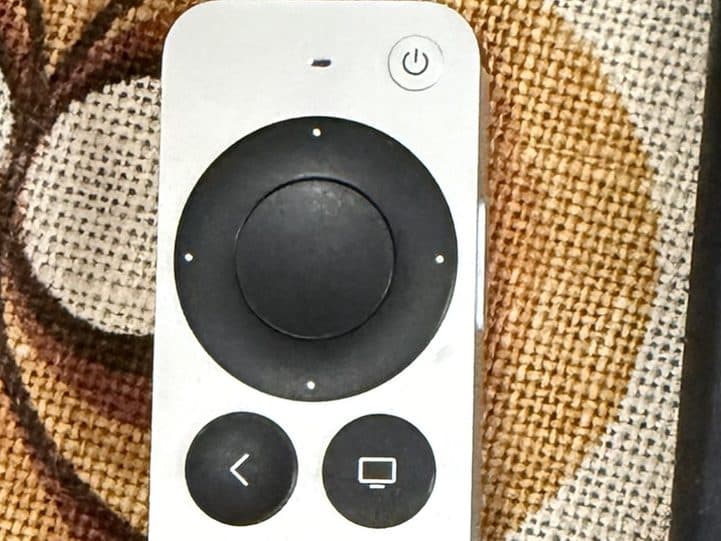 The silver Apple TV remote