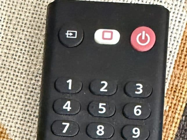 Input button, top left on the black remote