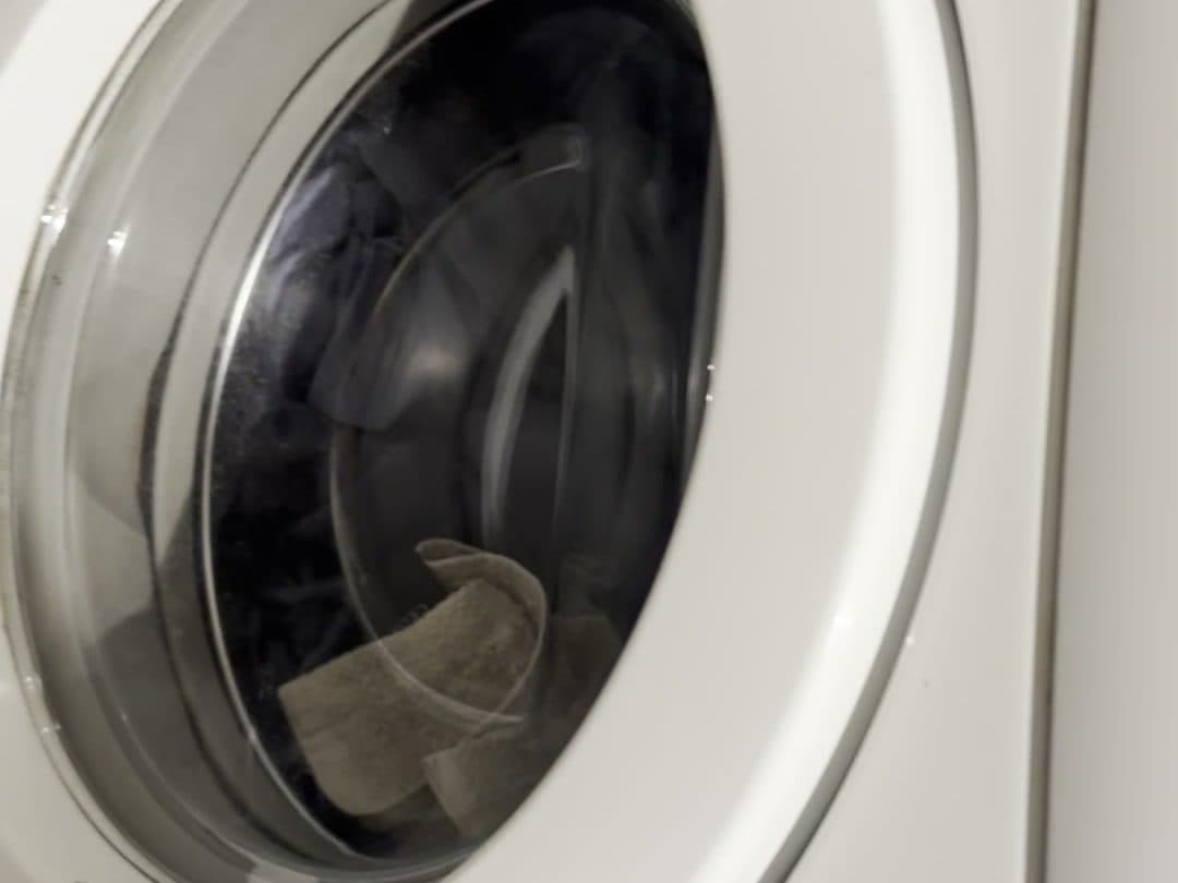 Laundry in the drum with the door closed